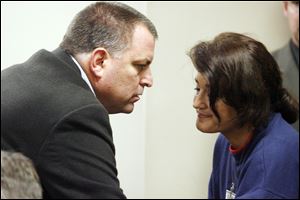 Tom and Bernadette Noe talk in 2006 before he was convicted. A Florida judge granted the dissolution of their marriage Thursday, but the Noes remain best of friends, Ms. Noe said.