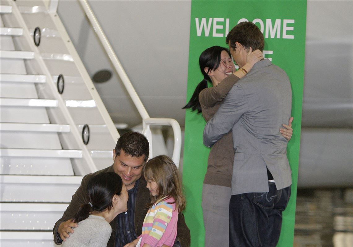 Freed U.S. journalists return home to emotional family reunion