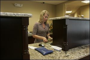 Amy Hayden-Wilson of Haskins is one of Waterford Bank s 29 employees. The bank serves an estimated 600 customers.
