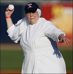 Mother Anne Joseph Doyle of the Little Sisters of the Poor throws out the first pitch before a Mud Hens game at the recent Little Sisters Day, a fund-raiser at Fifth Third Field. Two hundred guests, including some residents, had a cookout at the stadium. The Little Sisters operate the Sacred Heart Home on South Wynn Road in Oregon. Sacred Heart Home offers a continuum of care from independent living apartments to licensed residential and nursing care.