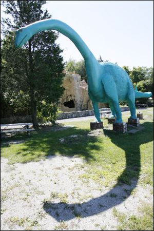 A dinosaur casts a shadow at the Prehistoric Forest
and Mystery Hill in Marblehead.