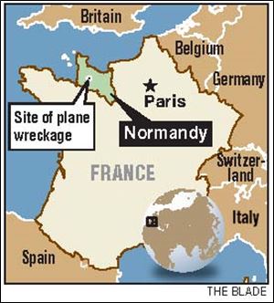 The crashed plane of a former East Toledo resident was discovered in May in Normandy.