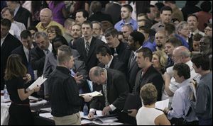 A spring job fair drew scores of applicants, but a national study finds the metro area is not creating enough jobs to ease unemployment.