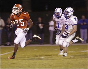 Southview's Mo May gets away from Anthony Wayne's Matt Green, right, and Mike Bridges on a 56-yard touchdown run in the second quarter. May later had a game-saving interception with no time on the clock. 