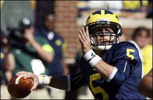 Michigan quarterback Tate Forcier looks downfield to throw a pass during the third quarter in an NCAA college football game against Eastern Michigan in Ann Arbor, Mich., Saturday, Sept. 19, 2009. Forcier was 7 of 13 for 68 yards in the Wolverines' 45-17 victory