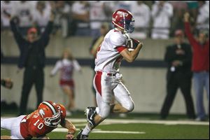  St. Francis receiver Scott Loy pulls away to score against Southview's Thomas Stichter. Loy has 15 catches for 350 yards. He has scored seven touchdowns. 
