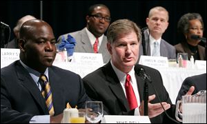 Toledo mayoral candidates Mike Bell, left, and Keith Wilkowski participate in a Toledo Regional Chamber of Commerce forum.