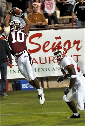 New Mexico State's Marcus Anderson catches the ball - but out of bounds - last week against Fresno State. The Aggies have struggled all season to make plays on offense.