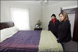 Slug:CTY tour08p                         Date 11/7/2009           The Blade/ Amy E. Voigt                   Location: Toledo, Ohio  CAPTION:  Lisa Crawford, left, and Nicole Reno, right, look at the master bedroom at 2313 Portsmouth during the Tour Toledo Preview of Homes tour that was open to the public on November 7, 2009.