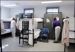 Carla Davis, left, and Angela Hayes are among the people sent to the Correctional Treatment Facility in downtown Toledo. The facility is used for court-ordered treatment in a residential setting. 