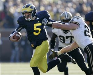 Michigan quarterback Tate Forcier breaks free of Purdue's Jason Werner in the fourth quarter. Forcier was sacked four times.
<br>
<img src=http://www.toledoblade.com/graphics/icons/photo.gif> <font color=red><b>VIEW</b></font>: <a href=