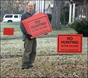 Ottawa Hills residents have taken sides in what Rob Slater and others are calling a ‘civil war.' Mr. Slater has chosen his side and is posting signs expressing his and other residents' opposition.