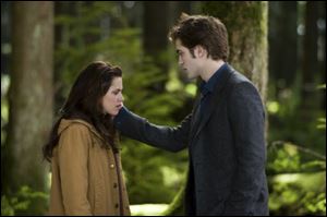 In this film publicity image released by Summit Entertainment, Kristen Stewart, left, and Robert Pattinson are shown in a scene from 