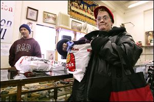 At the Toledo Gospel Rescue Mission's Mission Mall, opened in October on Ashland Avenue, Roxanne Batway shops for free.