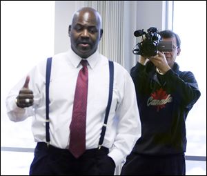 Mayor Mike Bell speaks to staff members on his first day in office as Bob Russ mans the camera.