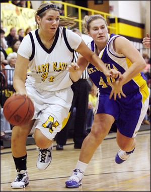Northview senior Olivia Fouty drives against St. Ursula's Isabelle Lishewski. Fouty averages 17.8 points per game and has surpassed 1,000 points for her career.