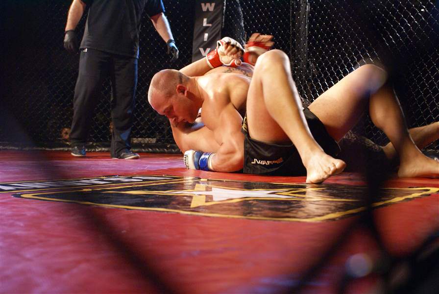 Woodmore-coach-doles-out-lessons-in-class-and-octagon