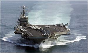  File photo shows the U.S. Navy aircraft carrier USS Carl Vinson patroling the Arabian Sea. The USS Carl Vinson is under way and expected to arrive off the coast of Haiti Thursday