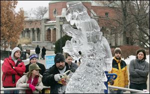 CTY frozen17p    01/16/2010       The Blade/Lori King  Ice Creations carver Gary Christinson chisels a dragon head during Frozentoesen activities at the Toledo Zoo.