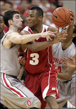 Ohio State's Jon Diebler guards Wisconsin's Trevon Hughes in last night's game.
