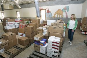 Putnam County Library Director Kelly Ward, in the abandoned Ottawa library in 2008, says the system is ready to rebuild.