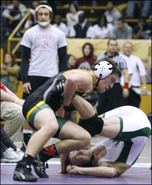 Clay's Angelo Amenta has the upper hand in a bout with Westland's Sean Clutter at the Mary Kerr Invitational tournament at Waite's field house.