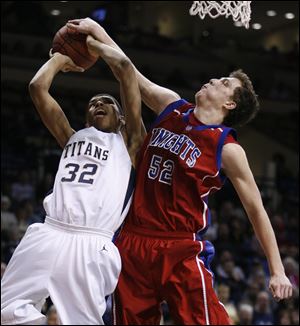 St. Francis' Storm Stanley tries to block a shot by St. John's Marc Loving in a City League semifinal.
<br>
<img src=http://www.toledoblade.com/assets/jpg/TO66067417.JPG> <b><font color=red>VIEW: </b></font color=red> <a href=