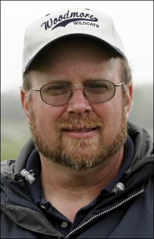 Mike Pendleton uses his business and people skills to help Woodmore's track program.