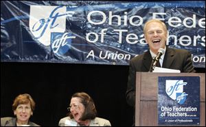 Randi Weingarten, left, national head of the American Federation of Teachers, and Sue Taylor, the Ohio AFT leader, laugh with Gov. Ted Strickland during his speech at the Park Inn.