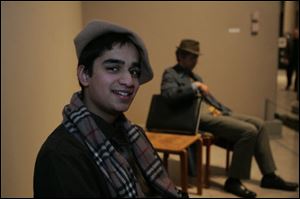 Ujesh Vora and ‘Executive,' a life-like statue by Duane Hanson, at the St. John's Jesuit High School Valentine's benefit at the Toledo Museum of Art.