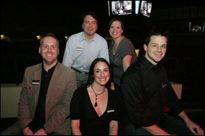 EPIC Toledo advisory board members, front row: Toledoans Jeff Schaaf, left, Rose Toth, and Doug Mallette. Rear, from left: Brian Niedzwiecki of Toledo and Megan Stockburger of Bowling Green at the EPIC birthday bash at the University of Toledo.