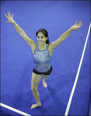 Karla Dixon of Ottawa Hills tied for first place at the
district meet for the all-around title.
