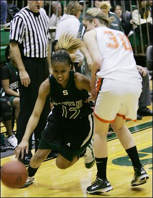 Start's Maleeka Kynard, No. 12, drives past Southview's Tiffany Scott in the semifinal game. Kynard racked up 25 points in Start's win over the Cougars.
<BR>
<img src=http://www.toledoblade.com/graphics/icons/photo.gif> <font color=red><b>PHOTO GALLERY</b></font>: <a href=