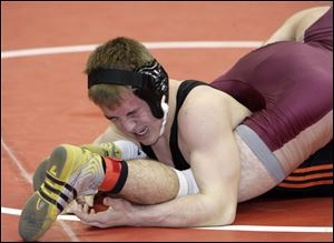 Van Buren's Chad Sonnenberg gets tangled up with Edgerton's Josh Goebel, who he beat 11-3 in a Division III state semifinal.