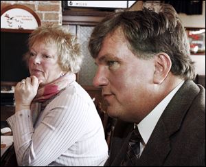 Dave Falkenberg, with his wife, Carol, says, 'Now that there's entertainment downtown, I suppose the city figures that's where the dollars are. But will it keep people from coming downtown?' Mr. Falkenberg played for the former Toledo Goaldiggers in the 1980s.