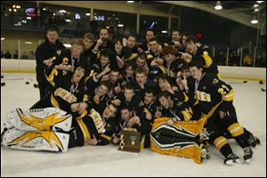 Northview celebrates with the district championship trophy after defeating Findlay last night. The Wildcats advance to the state's final four, looking for the first hockey title in the school's history. 
<BR>
<img src=http://www.toledoblade.com/graphics/icons/photo.gif> <font color=red><b>PHOTO GALLERY</b></font>: <a href=