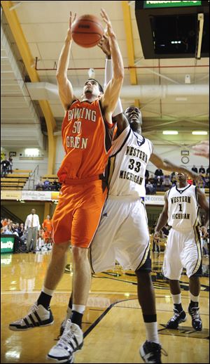 Bowling Green's Marc Larson grabs a rebound away from Western's Flenard Whitfield.