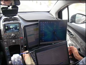 Computers display information from test sensors on a Chevy Volt. 
