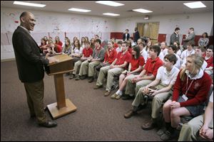 Former Indianapolis Colts coach Tony Dungy addresses students at Central Catholic High School about his book 'Uncommon.'