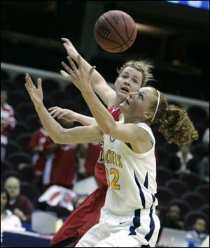 Toledo's Melissa Goodall reaches for the ball against Ball State in yesterday's MAC quarterfinal game at Cleveland. UT advances to play Kent State.