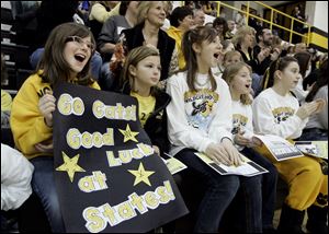 Courtney Cross, left, Payton Carter, Kelsi Omey, Lauren Elliott, and Morgan Korn cheer the Northview hockey team during a pep rally at the Sylvania school a day before today's semifinals in Columbus.
