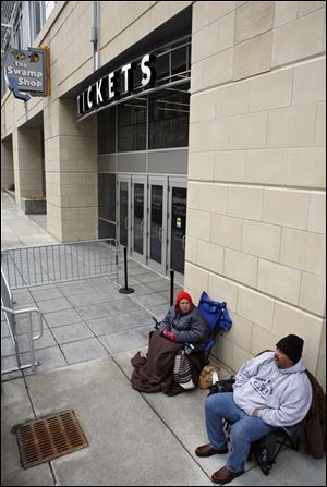 Slug: CTY elton13p 03 The Blade/Jeremy Wadsworth    Date: 03/12/10  Caption:  Mandy Flagg and Freddie Flores both of Toledo wait in line for tickets to go on sale for the Elton John concert Friday, 03/12/10, at the Lucas County Arena in Toledo, Ohio. Flagg said she is getting a ticket for her mother Deb Ostrander because seeing Elton John is number one on her 