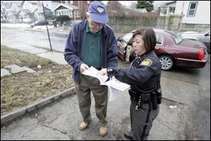 Marshall Isenberg and Deputy Barb Lau discuss a property for which they are determining a value.
Mr. Isenberg and other private appraisers are training Deputy Lau to do the job they are losing.