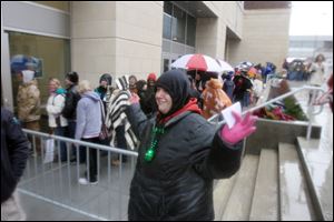 Mandy Flagg of Perrysburg Township nabs third-row seats for the April 25 concert. She had camped overnight at the arena.