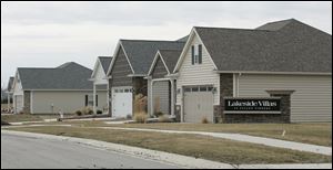 BIZ build14p  3/11/2010  The Blade/Dave Zapotosky Caption:  Homes already completed in the new Lakeside subdivision off of Monclova Road near Strayer Road in Monclova Township, Thursday, March 11, 2010. There is only home currently under construction there.