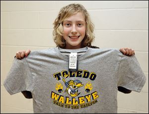 Eighth grader Savannah Compton of Genoa stands behind her winner in the middle/elementary competition.