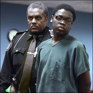 Anferney Fontenet, 15, is escorted from a courtroom after Juvenile Court Judge Connie Zemmelman ruled yesterday that the youth would be sent to adult court to face rape and robbery charges. The judge cited information about the youth's involvement in a 2008 rape attempt.