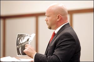 Robin Vess' attorney, Mark Davis, cross-examines Humane Society officer Nancy Silva. Mr. Davis said  more evidence would come out if the case goes to trial.
