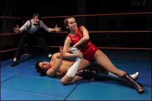 Torrey Wigfield is the referee, Louis Marino is Dean Rebel, and Arielle Goldman is Tanzi in the University of Michigan's production of the wrestling comedy ‘Trafford Tanzi' by Claire Luckham. 