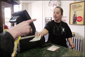 Bernice Smigielski, assistant manager at Tom's Carry Out on Lagrange Street in the central city's Polish Village, says many customers are eager for Powerball.